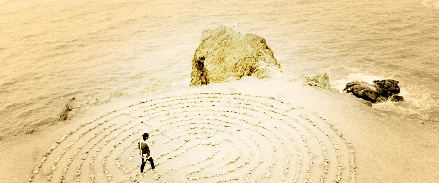 Walking through a labyrinth beside the sea